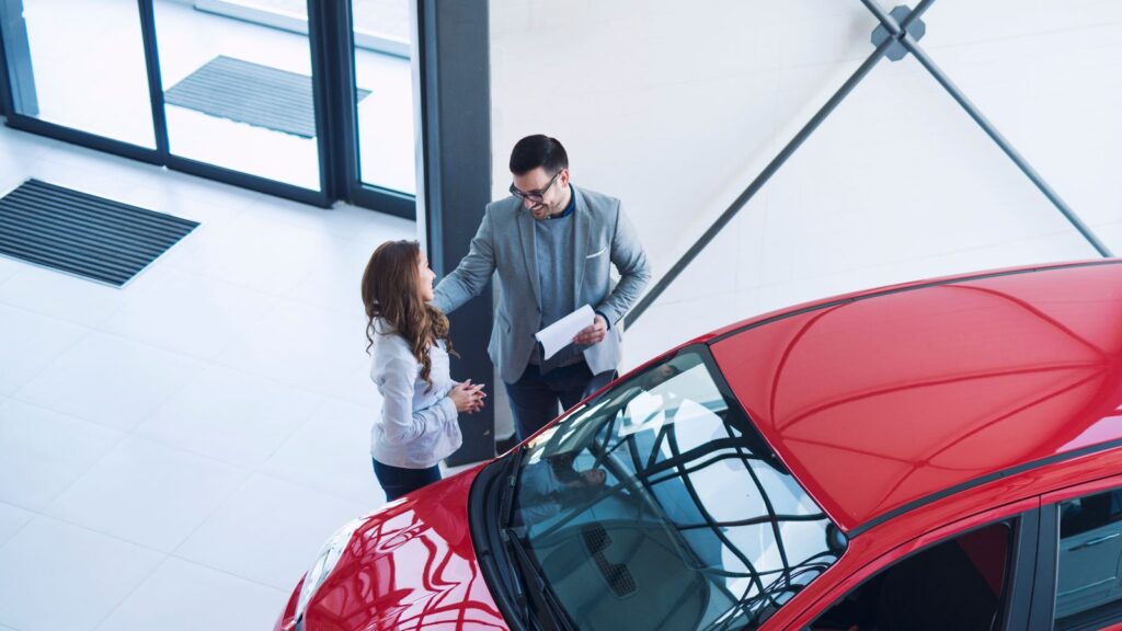 Car owner comparing vehicle trade-in value with outstanding finance